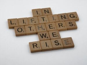 In lifting others-we-rise